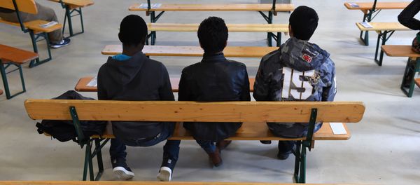 Migrants wait for the start of the rights education lessons for refugees and asylum seekers in a hall of the Bayernkaserne in Munich, southern Germany on February 24, 2016 - Sputnik International