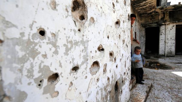In this picture taken Friday, Feb. 26, 2016, Syrian boys are seen inside their destroyed house at neighborhood of Baba Amr in Homs, Syria - Sputnik International