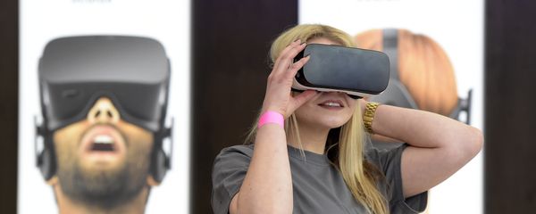 A woman uses a virtual reality device. A woman uses a virtual reality device. - Sputnik International