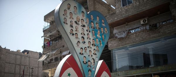 Photos of deceased residents of Damascus on a street of the city Photos of deceased residents of Damascus on a street of the city - Sputnik International