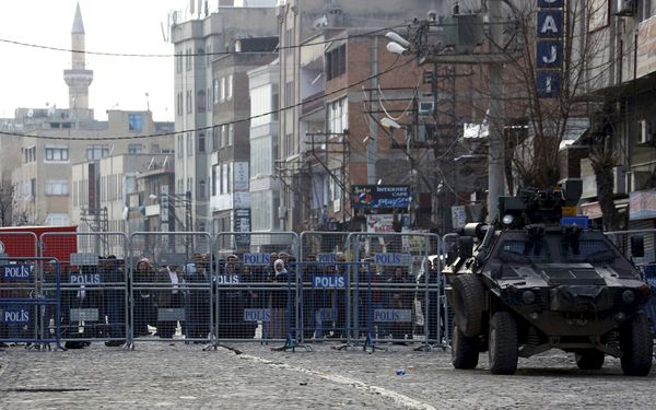 People stand behind the security barriers at one of the entrance of Sur district, which is partially under curfew, in the Kurdish-dominated southeastern city of Diyarbakir, Turkey February 26, 2016 People stand behind the security barriers at one of the entrance of Sur district, which is partially under curfew, in the Kurdish-dominated southeastern city of Diyarbakir, Turkey February 26, 2016 - Sputnik International