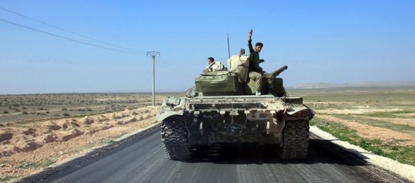 Syrian pro-government forces advance on a road through the town of Khanasser, which is the sole link between government-held areas in and around Aleppo and those in the rest of the country, after they reportedly recaptured it from Daesh terrorists on February 29, 2016 Syrian pro-government forces advance on a road through the town of Khanasser, which is the sole link between government-held areas in and around Aleppo and those in the rest of the country, after they reportedly recaptured it from Daesh terrorists on February 29, 2016 - Sputnik International