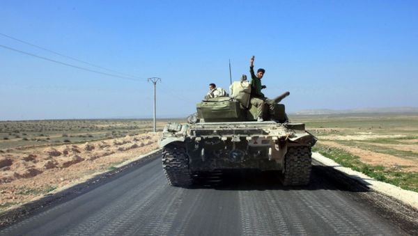 Syrian pro-government forces advance on a road through the town of Khanasser, which is the sole link between government-held areas in and around Aleppo and those in the rest of the country, after they reportedly recaptured it from Daesh terrorists on February 29, 2016 Syrian pro-government forces advance on a road through the town of Khanasser, which is the sole link between government-held areas in and around Aleppo and those in the rest of the country, after they reportedly recaptured it from Daesh terrorists on February 29, 2016 - Sputnik International