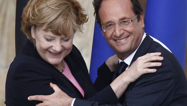 France's President Francois Hollande (R) German Chancellor Angela Merkel are pictured during a ceremony to commemorate the 50th anniversary of renewed Franco-German relations after World War II in Reims. (File) France's President Francois Hollande (R) German Chancellor Angela Merkel are pictured during a ceremony to commemorate the 50th anniversary of renewed Franco-German relations after World War II in Reims. (File) - Sputnik International