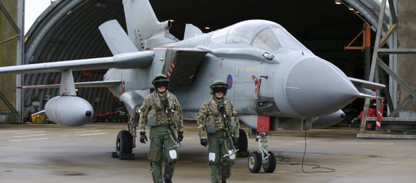 Pilots walk in front of a Tornado GR4 aircraft at the British Royal Air Force airbase RAF Marham in Norfolk in east England on December 2, 2015. - Sputnik International