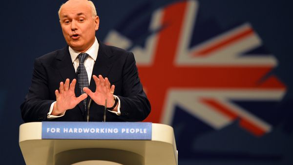 Iain Duncan-Smith, Secretary of State for Work and Pensions, addresses delegates at the annual Conservative Party Conference in Manchester, north-west England on October 1, 2013. Iain Duncan-Smith, Secretary of State for Work and Pensions, addresses delegates at the annual Conservative Party Conference in Manchester, north-west England on October 1, 2013. - Sputnik International