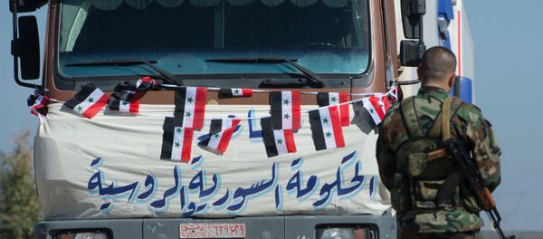 This file photo shows a convoy which delivered humanitarian aid in Syria This file photo shows a convoy which delivered humanitarian aid in Syria - Sputnik International