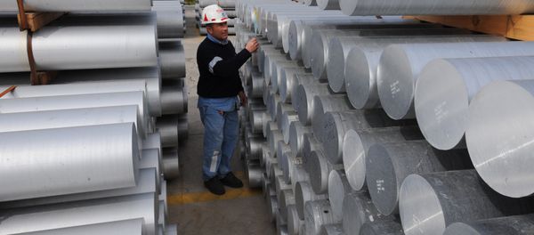 Aworker checks aluminum bars on February 15, 2010 at the US aluminium company Alcoa's plant in Portovesme. (File) Aworker checks aluminum bars on February 15, 2010 at the US aluminium company Alcoa's plant in Portovesme. (File) - Sputnik International