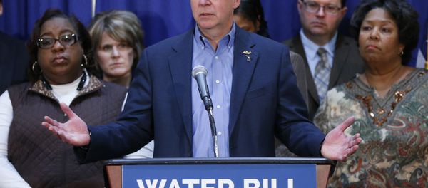 In this Feb. 26, 2016 photo, Gov. Rick Snyder speaks after attending a Flint Water Interagency Coordinating Committee meeting in Flint, Mich. The state of Michigan restricted Flint from switching water sources last April unless it got approval from Gov. Rick Snyder's administration under the terms of a $7 million loan needed to help transition the city from state management, according to a document released Wednesday, March 2, 2016. In this Feb. 26, 2016 photo, Gov. Rick Snyder speaks after attending a Flint Water Interagency Coordinating Committee meeting in Flint, Mich. The state of Michigan restricted Flint from switching water sources last April unless it got approval from Gov. Rick Snyder's administration under the terms of a $7 million loan needed to help transition the city from state management, according to a document released Wednesday, March 2, 2016. - Sputnik International