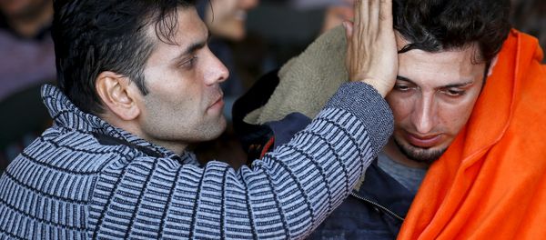 Refugees and migrants sit on board of Turkish Coast Guard Search and Rescue ship Umut-703 off the shores of Izmir, Turkey, after a failed attempt of crossing to the Greek island of Chios, February 28, 2016. Refugees and migrants sit on board of Turkish Coast Guard Search and Rescue ship Umut-703 off the shores of Izmir, Turkey, after a failed attempt of crossing to the Greek island of Chios, February 28, 2016. - Sputnik International