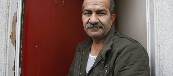 Iranian asylum seeker Mohammed Bagher Beyzevi poses for a photograph outside his home on Union Street in Middlesbrough, northern Britain, in this file photograph dated January 20, 2016. - Sputnik International