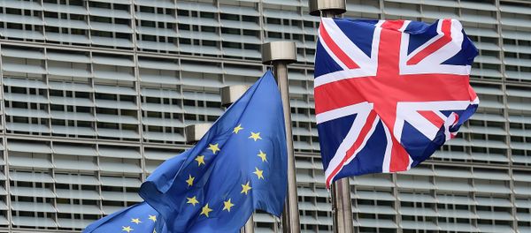 A British flag flutters amongst EU flags ahead of British Prime Minister's visit at the European Commission in Brussels on January 29, 2016 - Sputnik International