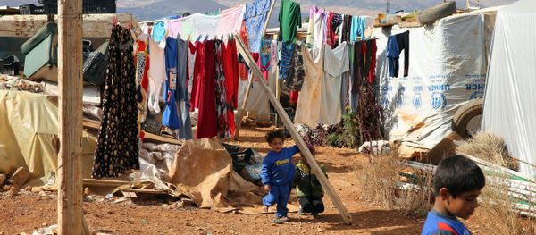 Syrian refugee children stand on November 15, 2015, at a makeshift camp by Taybeh village, in Lebanon's eastern Bekaa Valley Syrian refugee children stand on November 15, 2015, at a makeshift camp by Taybeh village, in Lebanon's eastern Bekaa Valley - Sputnik International