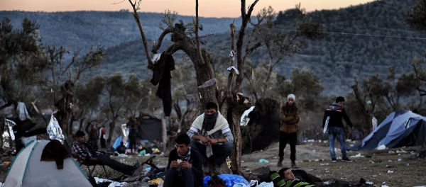 Refugees and migrants live at a field outside the Moria Hot Spot on the Greek Lesbos island on November 12, 2015 Refugees and migrants live at a field outside the Moria Hot Spot on the Greek Lesbos island on November 12, 2015 - Sputnik International