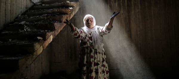 A woman reacts while walking among the ruins of damaged buildings following heavy fighting between government troops and Kurdish fighters, on March 2, 2016 in the southeastern Turkey Kurdish town of Cizre, near the border with Syria and Iraq A woman reacts while walking among the ruins of damaged buildings following heavy fighting between government troops and Kurdish fighters, on March 2, 2016 in the southeastern Turkey Kurdish town of Cizre, near the border with Syria and Iraq - Sputnik International