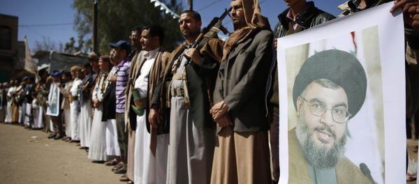 Shiite rebels, known as Houthis, hold a poster of Hezbollah leader Sheikh Hassan Nasrallah during a gathering to show their support to Hezbollah in Sanaa, Yemen, Thursday, March 3, 2016 - Sputnik International