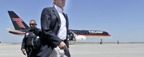 Republican presidential hopeful Donald Trump walks the tarmac before boarding his campaign plane to depart from Laredo, Texas, Thursday, July 23, 2015 Republican presidential hopeful Donald Trump walks the tarmac before boarding his campaign plane to depart from Laredo, Texas, Thursday, July 23, 2015 - Sputnik International
