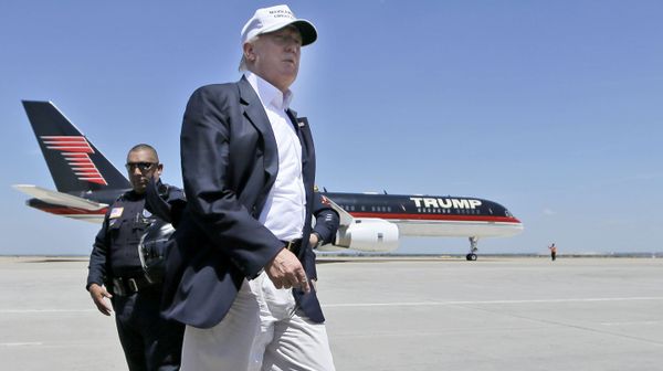 Republican presidential hopeful Donald Trump walks the tarmac before boarding his campaign plane to depart from Laredo, Texas, Thursday, July 23, 2015 Republican presidential hopeful Donald Trump walks the tarmac before boarding his campaign plane to depart from Laredo, Texas, Thursday, July 23, 2015 - Sputnik International