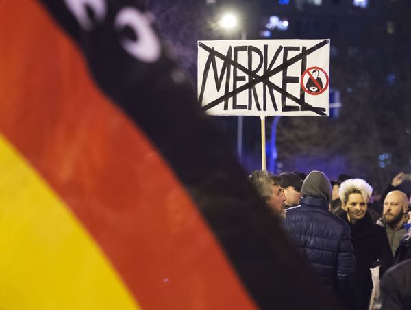 People wave German flags in Erfurt, central Germany,during a demonstration initiated by the Alternative for Germany (AfD) party against the immigration situation. - Sputnik International