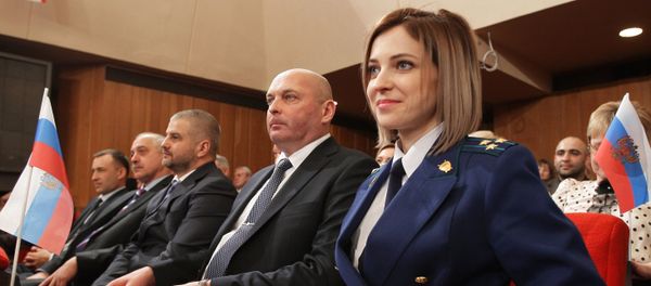 Crimean Prosecutor Natalya Poklonskaya at the meeting of deputies of the State Council of the Republic of Crimea which is dedicated to the one-year anniversary of the Crimean Spring in Simferopol Crimean Prosecutor Natalya Poklonskaya at the meeting of deputies of the State Council of the Republic of Crimea which is dedicated to the one-year anniversary of the Crimean Spring in Simferopol - Sputnik International