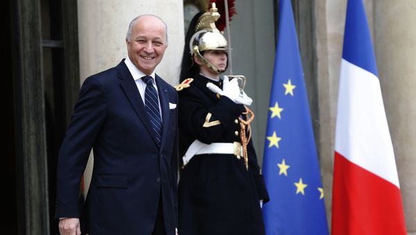 Former French foreign minister Laurent Fabius leaves the Elysee Palace in Paris, after he took the oath as new President of the French Constitutional Council, on March 8, 2016 - Sputnik International