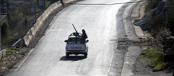 Syrian troops ride on a pickup truck with a mounted machine gun on a road near Latakia in Syria, March 2, 2016 Syrian troops ride on a pickup truck with a mounted machine gun on a road near Latakia in Syria, March 2, 2016 - Sputnik International