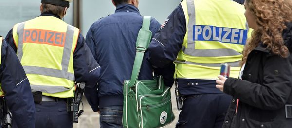 Police lead away a man at the main train station Tuesday, Jan. 12, 2016, in Cologne, Germany Police lead away a man at the main train station Tuesday, Jan. 12, 2016, in Cologne, Germany - Sputnik International