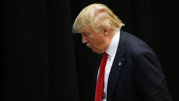 US Republican presidential candidate Donald Trump looks down as he leaves a campaign event in Concord, North Carolina March 7, 2016. - Sputnik International