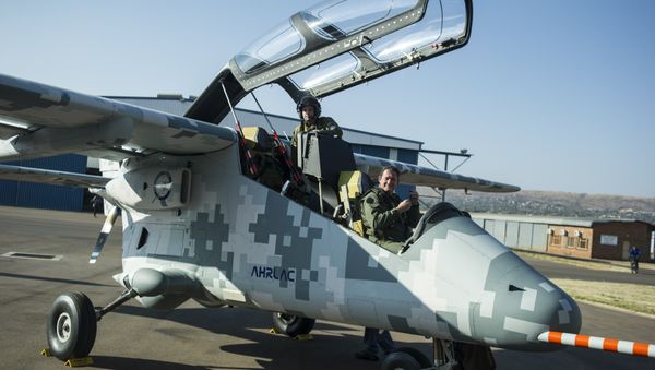 Pilots of the AHRLAC (Advanced High-Performance Reconnaissance Light Aircraft), designed by Paramount Group, Africa's largest privately-owned defence and aerospace company, look on within the first public flight of Africa's first wholly designed and built military fixed wing aircraft, at the Wonderboom airport in Pretoria on August 13, 2014 Pilots of the AHRLAC (Advanced High-Performance Reconnaissance Light Aircraft), designed by Paramount Group, Africa's largest privately-owned defence and aerospace company, look on within the first public flight of Africa's first wholly designed and built military fixed wing aircraft, at the Wonderboom airport in Pretoria on August 13, 2014 - Sputnik International