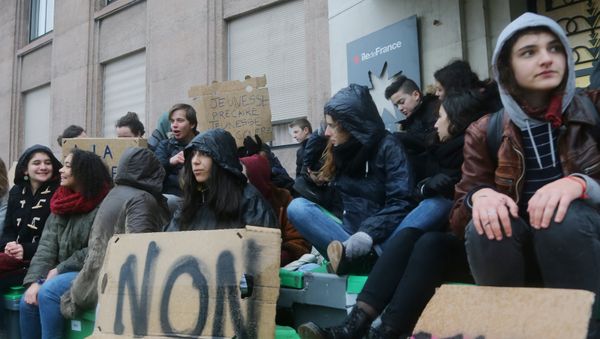 Students sit outside their high school in Paris, Wednesday , March 9, 2016. Students sit outside their high school in Paris, Wednesday , March 9, 2016. - Sputnik International