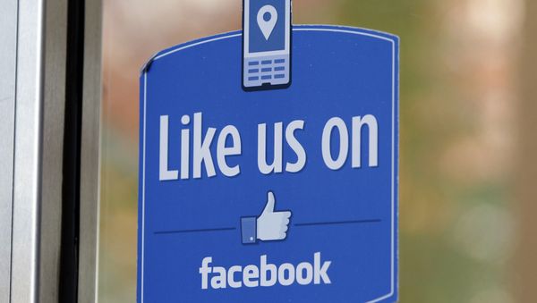 FILE - In this Dec. 13, 2011 file photo, a sign with Facebook's Like logo is posted at Facebook headquarters near the office for the company's User Operations Safety Team in Menlo Park, Calif. FILE - In this Dec. 13, 2011 file photo, a sign with Facebook's Like logo is posted at Facebook headquarters near the office for the company's User Operations Safety Team in Menlo Park, Calif. - Sputnik International