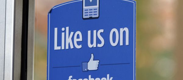 FILE - In this Dec. 13, 2011 file photo, a sign with Facebook's Like logo is posted at Facebook headquarters near the office for the company's User Operations Safety Team in Menlo Park, Calif. - Sputnik International