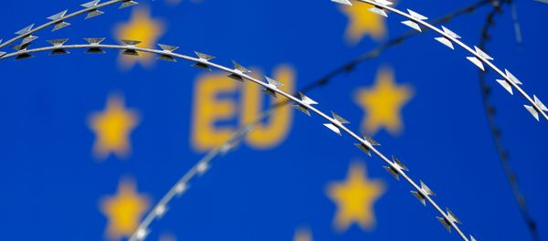 Razor wire is seen in front of an European Union (EU) sign during a protest against barbed wire fences along the border crossing between Slovenia and Croatia in Brezovica pri Gradinu, Slovenia, in this file picture taken December 19, 2015. Razor wire is seen in front of an European Union (EU) sign during a protest against barbed wire fences along the border crossing between Slovenia and Croatia in Brezovica pri Gradinu, Slovenia, in this file picture taken December 19, 2015. - Sputnik International