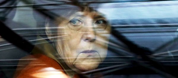 In this file photo Germany's Chancellor Angela Merkel arrives at an EU-Turkey summit in Brussels, as the bloc is looking to Ankara to help it curb the influx of refugees and migrants flowing into Europe, March 7, 2016. - Sputnik International
