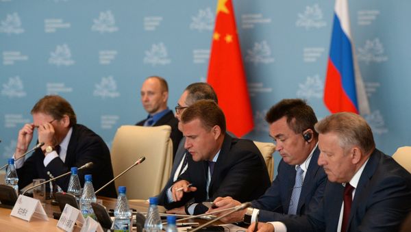 Alexei Chekunkov (center), CEO, JSC Far East and Baikal Region Development Fund, attends the Country Dialogue Russia-China at the Eastern Economic Forum in Vladivostok Alexei Chekunkov (center), CEO, JSC Far East and Baikal Region Development Fund, attends the Country Dialogue Russia-China at the Eastern Economic Forum in Vladivostok - Sputnik International