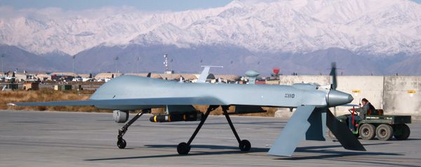 US Predator unmanned drone armed with a missile setting off from its hangar at Bagram air base in Afghanistan, November 27, 2009. - Sputnik International