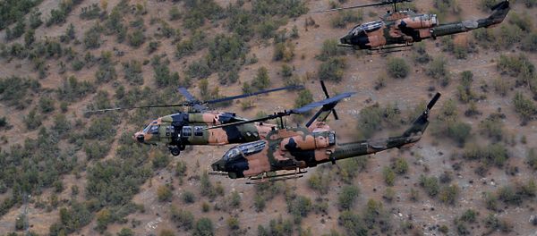 Military helicopters fly close to protect Turkish President Abdullah Gul and top army commanders aboard other helicopters over Hakkari province, Turkey as he visits Turkish troops at the border with Iraq. - Sputnik International