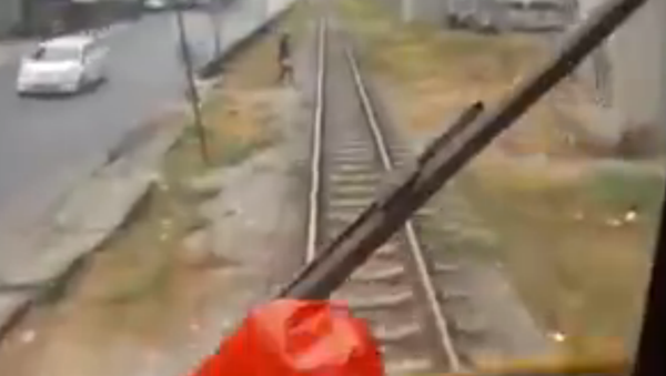Train about to hit a guy - Sputnik International