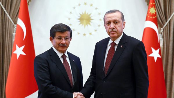 A handout image made available by the Turkish Presidential Press Office on January 29, 2015, shows Turkish President Recep Tayyip Erdogan (R) shaking hands with Turkish Prime Minister Ahmet Davutoglu at Presidential Palace in Ankara. A handout image made available by the Turkish Presidential Press Office on January 29, 2015, shows Turkish President Recep Tayyip Erdogan (R) shaking hands with Turkish Prime Minister Ahmet Davutoglu at Presidential Palace in Ankara. - Sputnik International