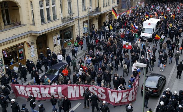 Far right-wing supporters march during rally against the German government's immigration policies and migrants, near-by the Chancellery in Berlin, Germany. - Sputnik International