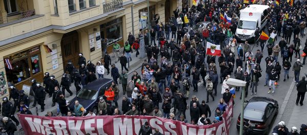 Far right-wing supporters march during rally against the German government's immigration policies and migrants, near-by the Chancellery in Berlin, Germany - Sputnik International