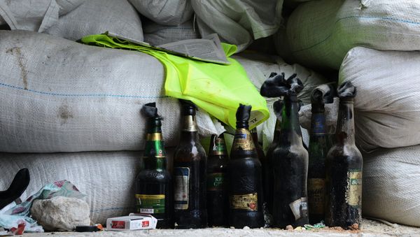 Bottles with Molotov cocktails at a checkpoint near Druzhba cafe burnt out in the armed clash outside Karlivka village, Donetsk Region. (File) - Sputnik International