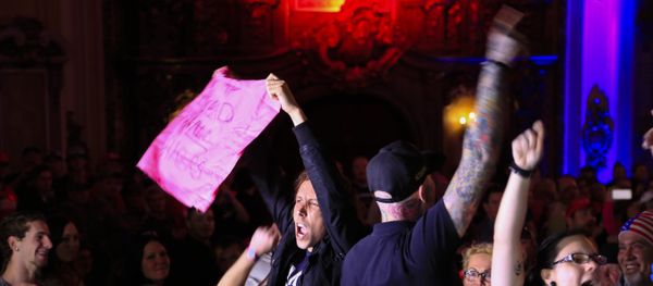 Demonstrators disrupt an election rally by Republican presidential candidate Donald Trump in Kansas City, Mo., Saturday, March 12, 2016. - Sputnik International