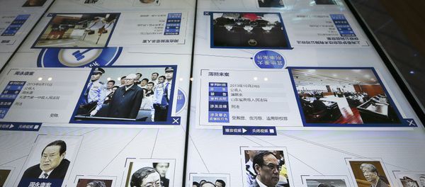 visitor, top, looks at an electronic screen displaying images and convicted corruption charges of China's fallen politicians, Bo Xilai, bottom second right, Zhou Yongkang, bottom left, and other senior officials, at the China Court Museum in Beijing, Tuesday, Jan. 12, 2016 visitor, top, looks at an electronic screen displaying images and convicted corruption charges of China's fallen politicians, Bo Xilai, bottom second right, Zhou Yongkang, bottom left, and other senior officials, at the China Court Museum in Beijing, Tuesday, Jan. 12, 2016 - Sputnik International