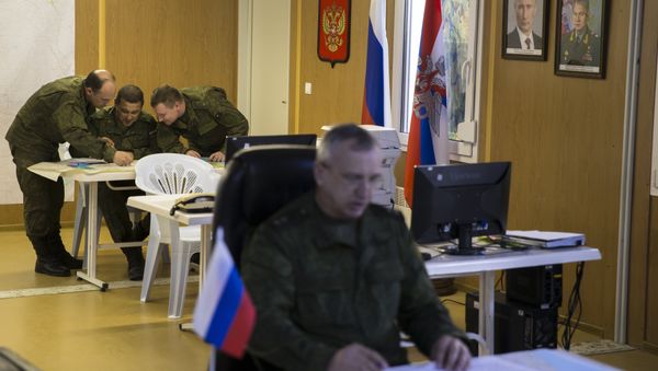 Russian officers talk over a map in the Russian military coordination center at Hmeimim air base in Syria, Friday, March 4, 2016 Russian officers talk over a map in the Russian military coordination center at Hmeimim air base in Syria, Friday, March 4, 2016 - Sputnik International