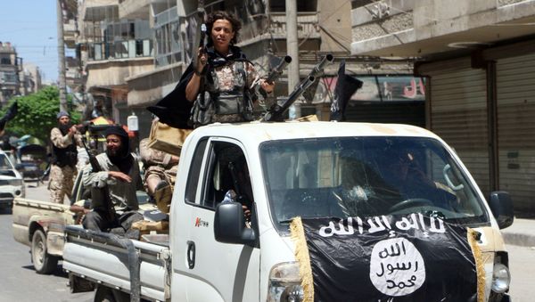 Fighters from Al-Qaeda's Syrian affiliate Al-Nusra Front drive in armed vehicles in the northern Syrian city of Aleppo as they head to a frontline, on May 26, 2015 Fighters from Al-Qaeda's Syrian affiliate Al-Nusra Front drive in armed vehicles in the northern Syrian city of Aleppo as they head to a frontline, on May 26, 2015 - Sputnik International