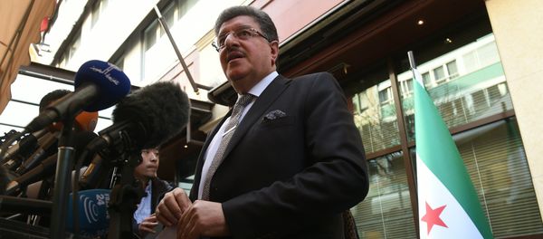 High Negotiations Committee (HNC) spokesman Salem al-Meslet speaks during a press conference on the eve of the second round of Syrian peace talks in Geneva on March 13, 2016 - Sputnik International