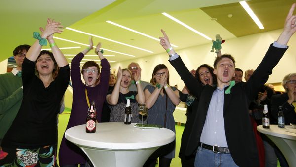 Greens party party supporters celebrate following first exit polls in the state election in Baden-Wuerttemberg in Stuttgart, Germany, March 13, 2016 Greens party party supporters celebrate following first exit polls in the state election in Baden-Wuerttemberg in Stuttgart, Germany, March 13, 2016 - Sputnik International