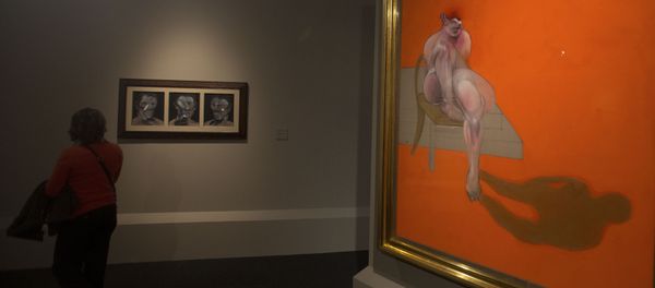A woman looks at Francis Bacon's 3 Studies of Peter Beard left alongside part of Bacon's Triptych at the Abello Collection exhibition in Madrid, Spain, Wednesday, Nov. 5, 2014. A woman looks at Francis Bacon's 3 Studies of Peter Beard left alongside part of Bacon's Triptych at the Abello Collection exhibition in Madrid, Spain, Wednesday, Nov. 5, 2014. - Sputnik International