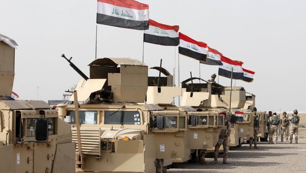 Iraqi security forces ride in vehicles travelling to Mosul to fight against militants of Islamic State at an Iraqi army base in Camp Taji in Baghdad, February 21, 2016 - Sputnik International